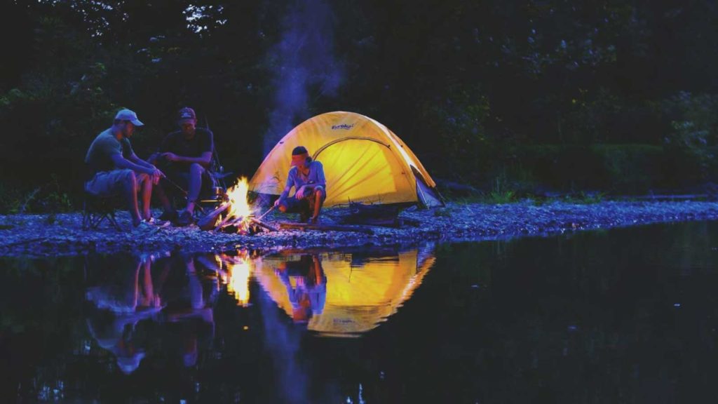 Family Tent Camping creekside with a fire